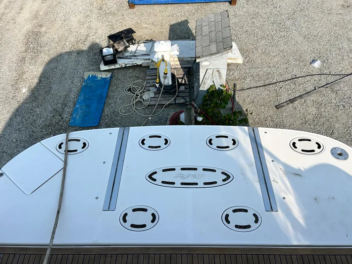  Yacht Photos Pics 2007 Sea Ray 52 Sundancer swim platform with equipment and ropes on a gravel surface.