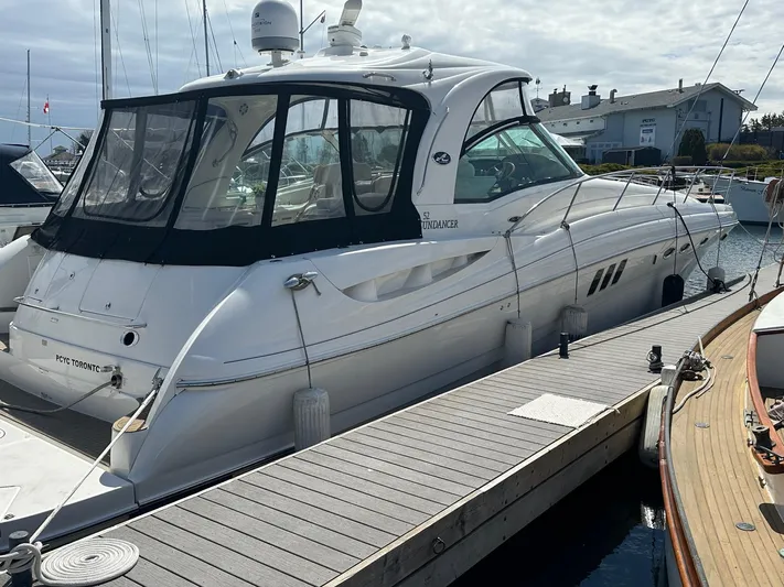  Yacht Photos Pics 2007 Sea Ray 52 Sundancer yacht docked at marina, featuring sleek design and spacious cabin.