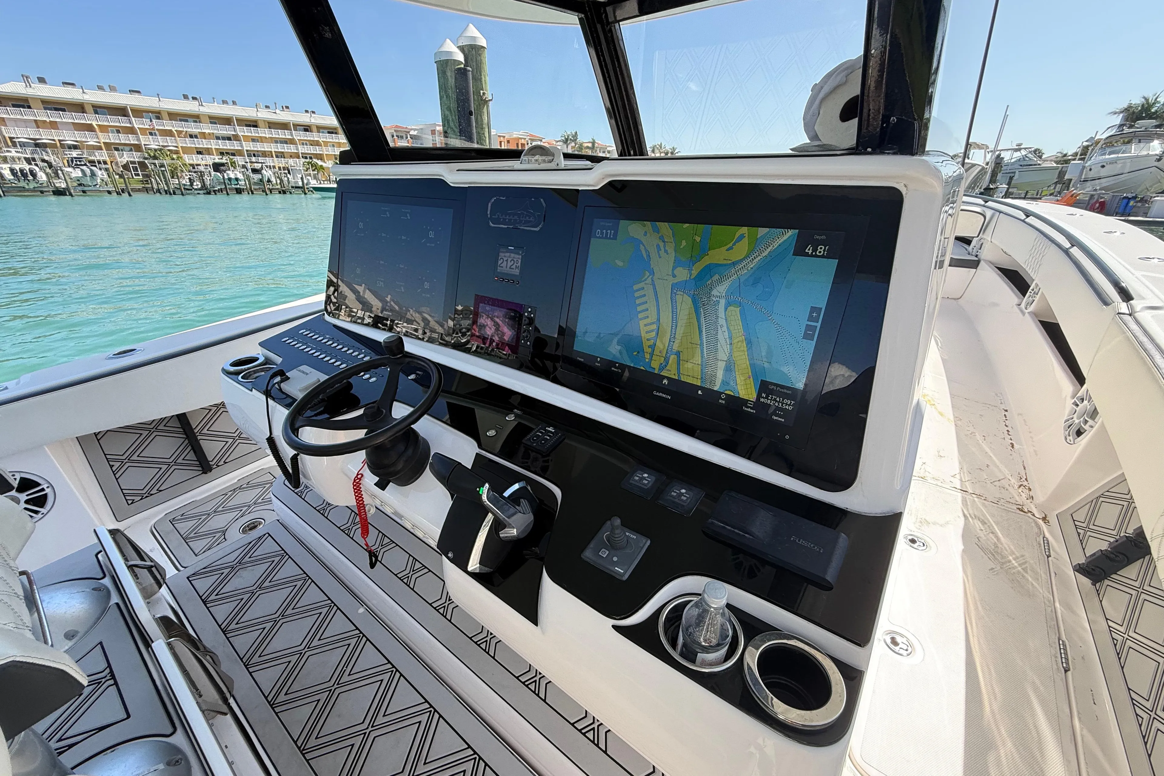 Helm of 2020 Streamline 45 boat with advanced navigation system and steering wheel.