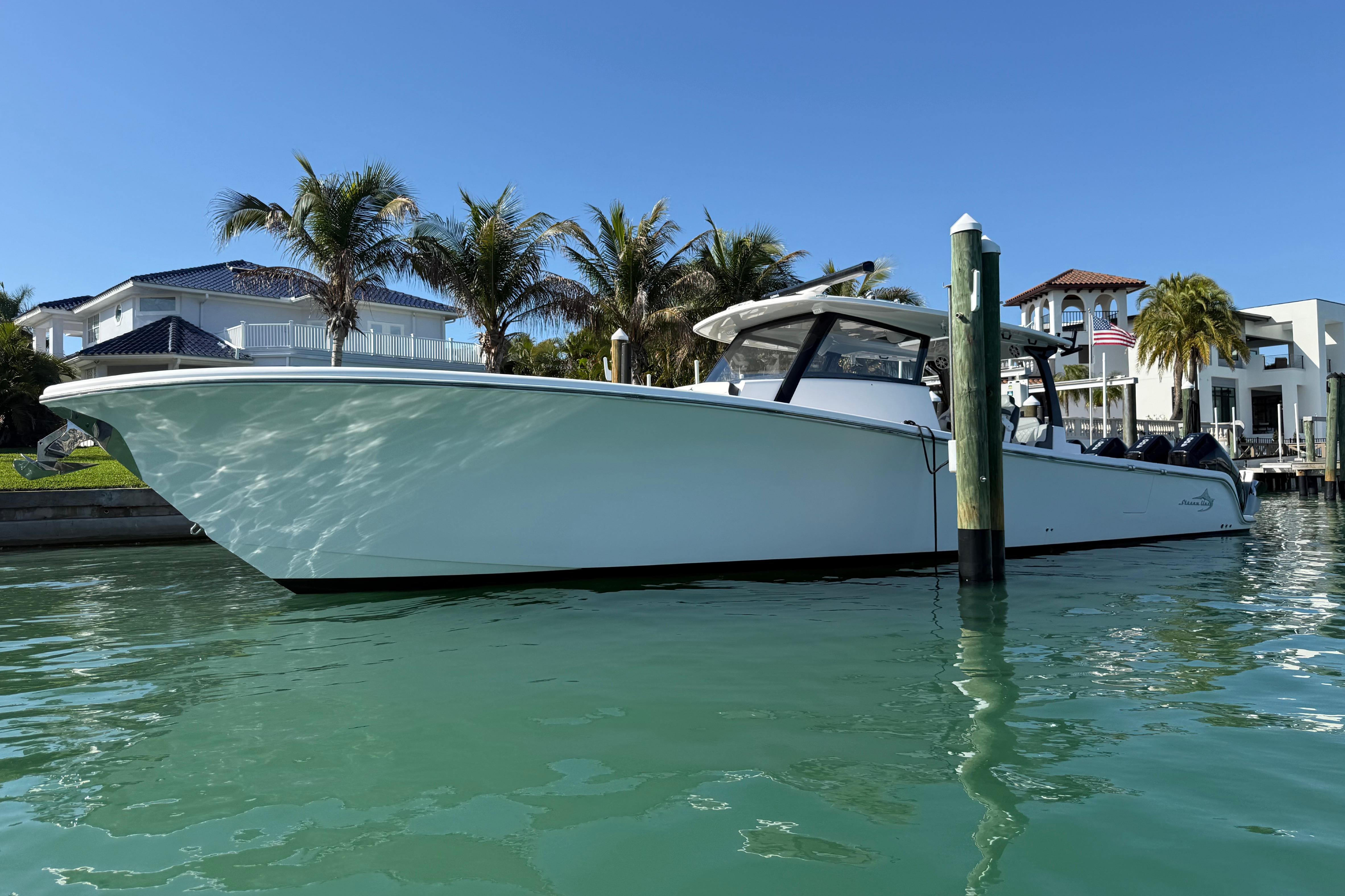Streamline 45 boat docked near luxury waterfront homes, 2020 model.