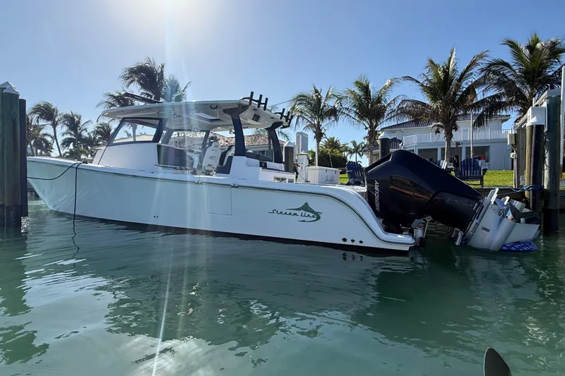  Yacht Photos Pics 2020 Streamline 45 boat docked in sunny marina with palm trees.