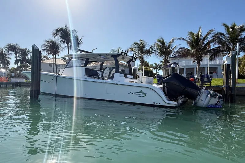  Yacht Photos Pics 2020 Streamline 45 boat docked in sunny marina with palm trees.