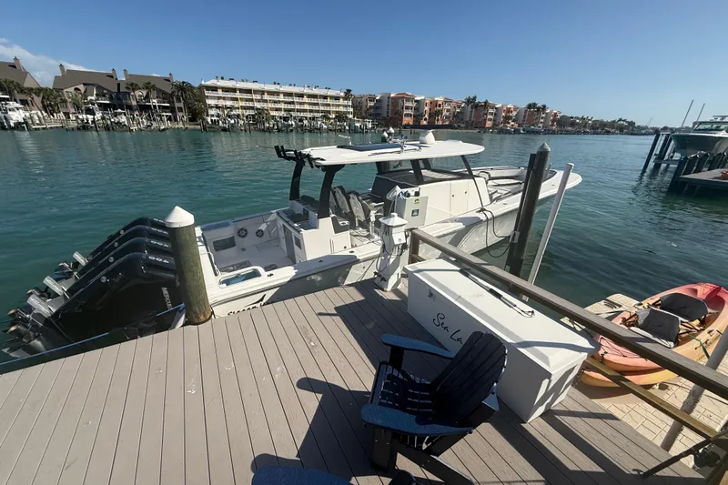  Yacht Photos Pics Docked 2020 Streamline 45 boat with multiple engines in a scenic marina setting.