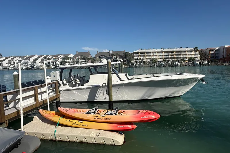  Yacht Photos Pics Streamline 45 boat docked with kayaks, waterfront view, 2020 model.