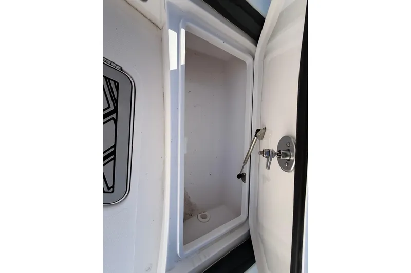  Yacht Photos Pics Open storage compartment in 2020 Streamline 45 vehicle, featuring secure latch mechanism.