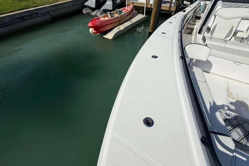  Yacht Photos Pics Streamline 45 boat docked near a red kayak, 2020 model.