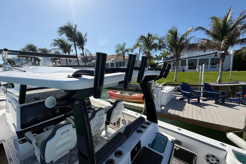  Yacht Photos Pics 2020 Streamline 45 boat docked near palm trees and waterfront homes.