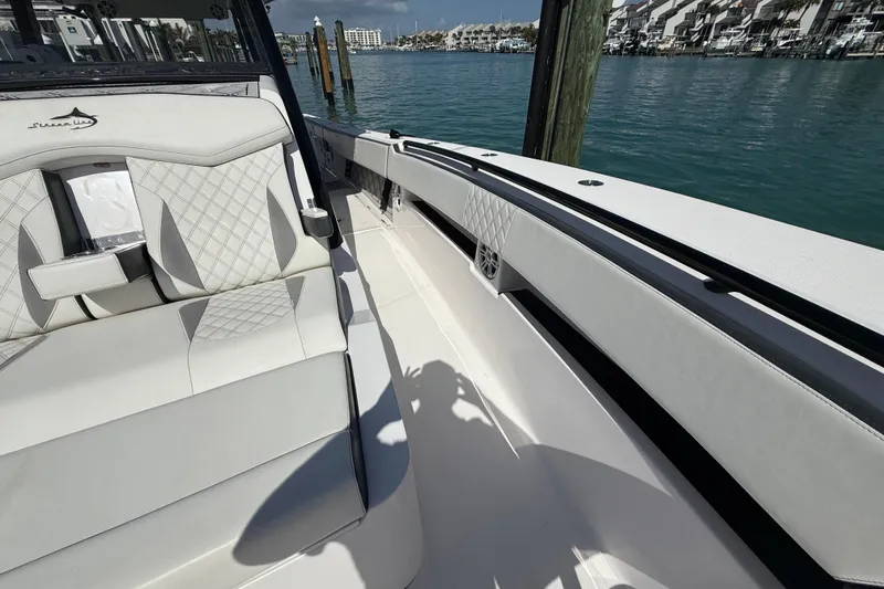  Yacht Photos Pics Luxurious interior of 2020 Streamline 45 boat with white seating and waterfront view.