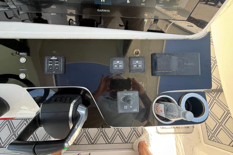  Yacht Photos Pics Control panel of a 2020 Streamline 45 boat with Garmin display and cup holders.