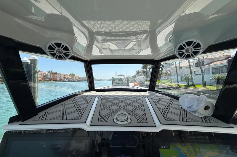  Yacht Photos Pics Interior view of a 2020 Streamline 45 boat, showcasing dashboard and waterfront scenery.