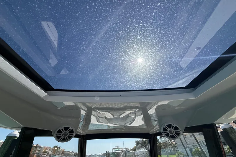 Yacht Photos Pics Clear glass roof of 2020 Streamline 45 boat under sunny sky.
