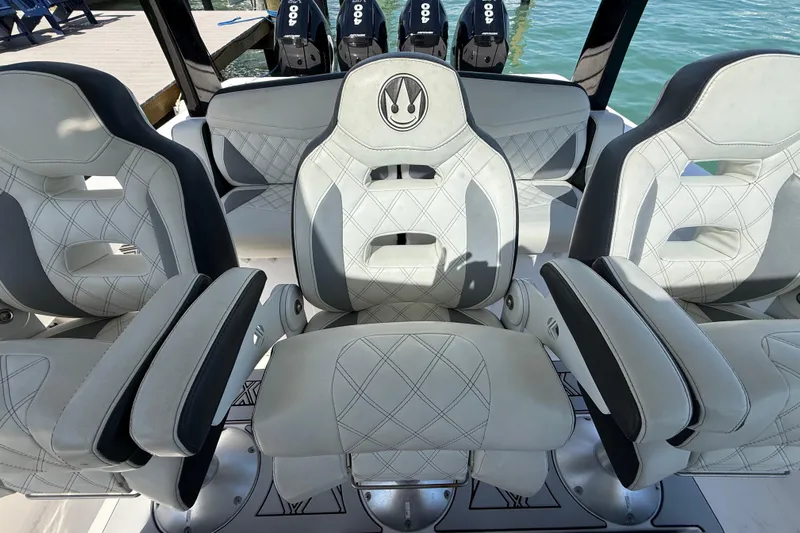  Yacht Photos Pics Luxury boat seating with diamond stitching, Streamline 45 model, 2020, docked by the water.