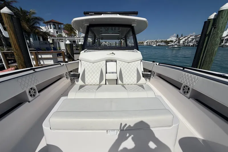  Yacht Photos Pics Streamline 45 boat interior with white seating, docked by waterfront homes, 2020 model.