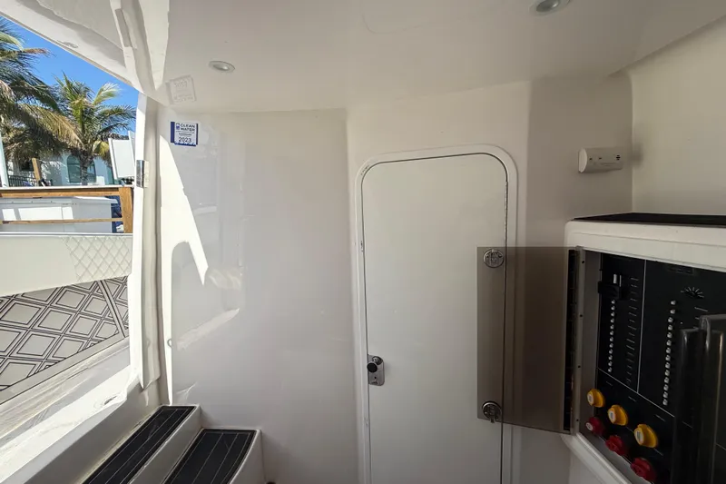  Yacht Photos Pics Interior of 2020 Streamline 45 boat with control panel and door, featuring modern design.