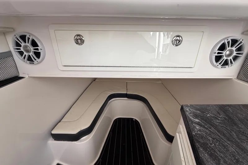  Yacht Photos Pics 2020 Streamline 45 boat interior with seating, speakers, and storage compartment.