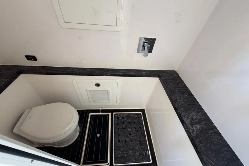  Yacht Photos Pics Compact bathroom with modern fixtures in a 2020 Streamline 45 model.