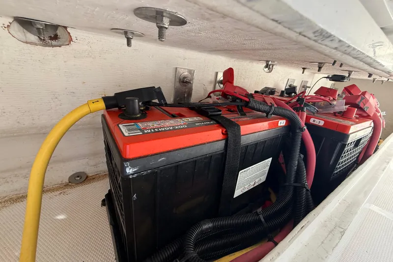  Yacht Photos Pics Battery compartment of a 2020 Streamline 45 with red and black cables.