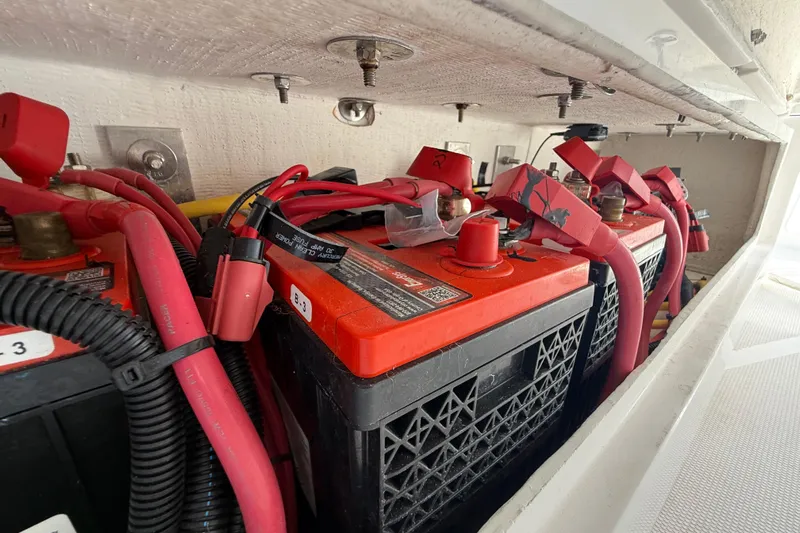  Yacht Photos Pics Red battery setup in a 2020 Streamline 45, featuring multiple cables and connectors.