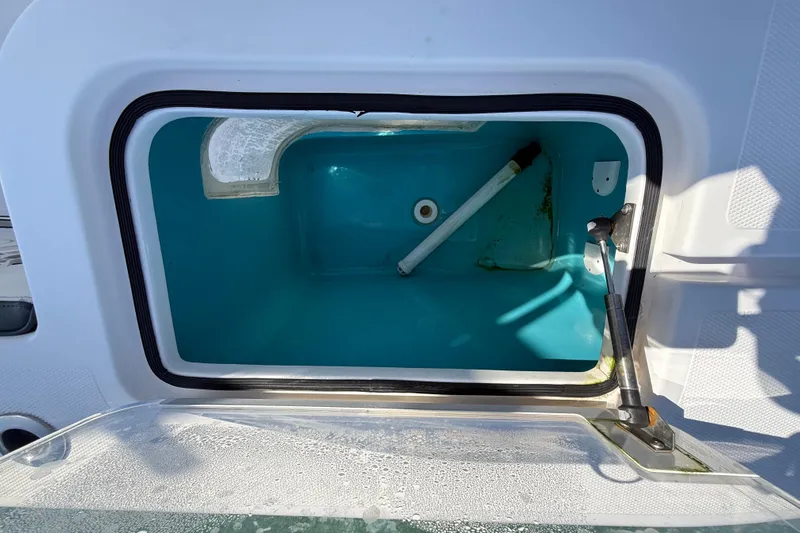  Yacht Photos Pics Open storage compartment on a 2020 Streamline 45 boat, featuring a blue interior.