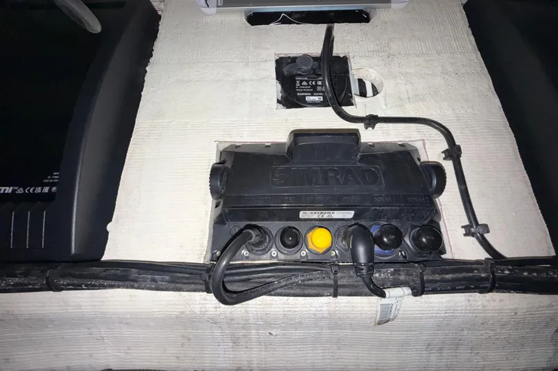  Yacht Photos Pics Electrical panel with Simrad device and cables in a 2020 Streamline 45 boat.