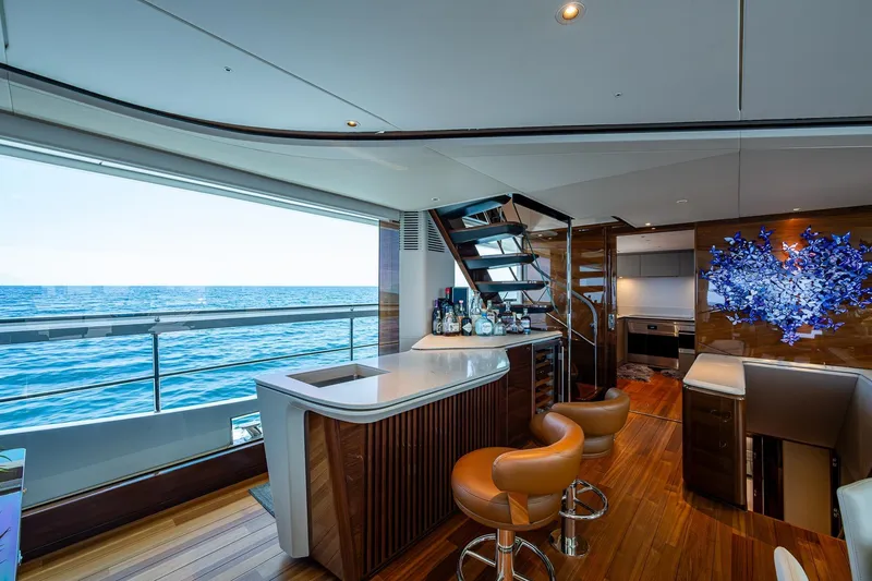  Yacht Photos Pics Luxurious interior of 2022 Princess X95 yacht with ocean view, bar, and modern decor.