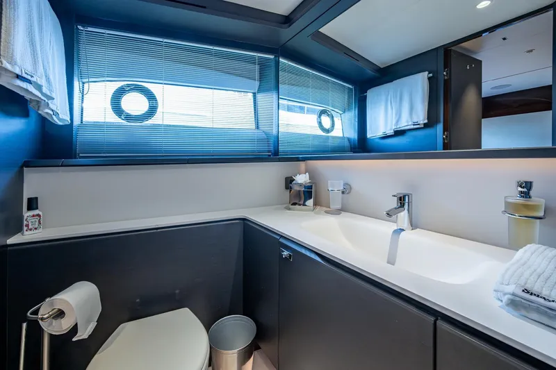  Yacht Photos Pics Luxurious bathroom in 2022 Princess X95 yacht with modern fixtures and elegant design.
