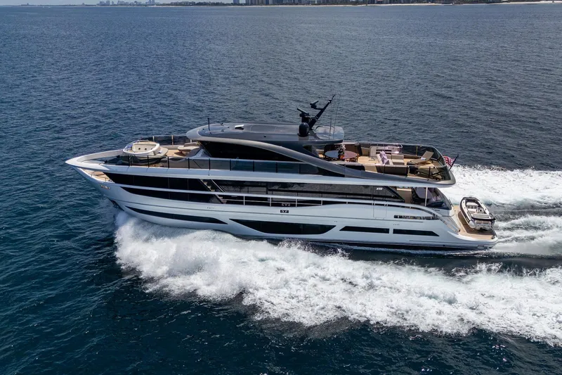  Yacht Photos Pics Luxurious 2022 Princess X95 yacht cruising on open sea, showcasing sleek design and elegance.