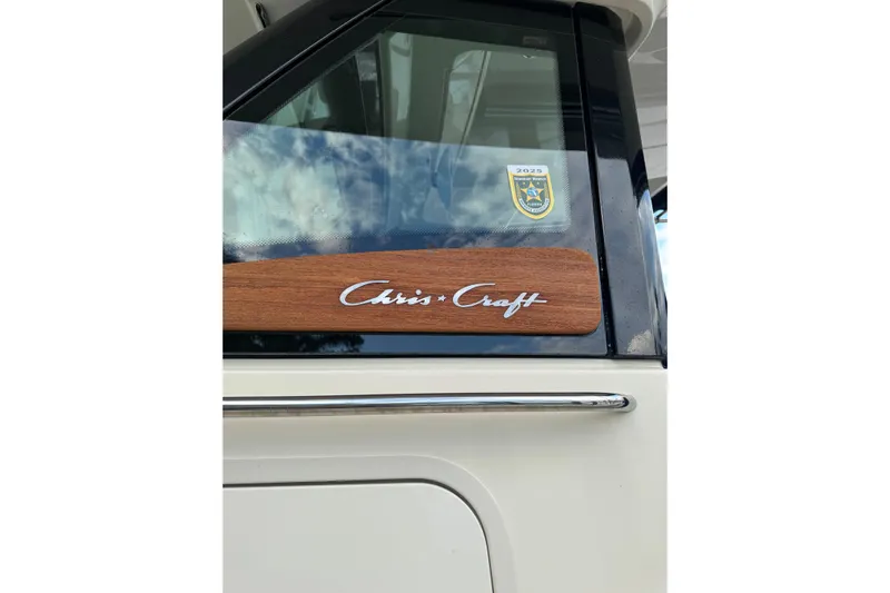 Para-dice Yacht Photos Pics 2023 Chris-Craft Catalina 30 boat with logo and window detail.