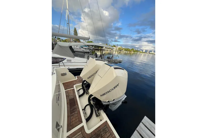 Para-dice Yacht Photos Pics 2023 Chris-Craft Catalina 30 with Mercury engines docked by the water.