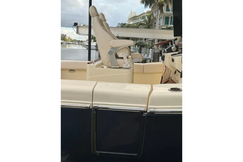 Para-dice Yacht Photos Pics 2023 Chris-Craft Catalina 30 boat interior with luxurious seating and waterfront view.