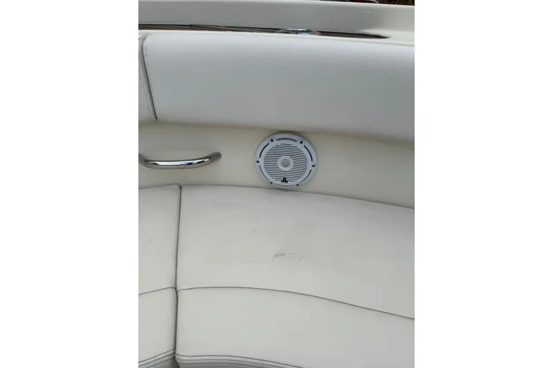 Para-dice Yacht Photos Pics 2023 Chris-Craft Catalina 30 interior with white seating and built-in speaker.