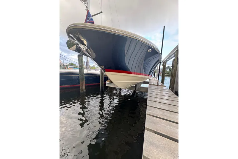 Para-dice Yacht Photos Pics 2023 Chris-Craft Catalina 30 boat docked, showcasing sleek design and elegant blue hull.