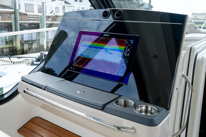  Yacht Photos Pics 2024 Boston Whaler 405 Conquest dashboard with Simrad display and cup holders.
