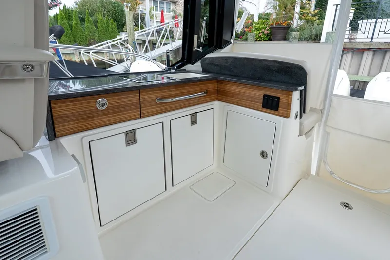  Yacht Photos Pics Interior view of 2024 Boston Whaler 405 Conquest boat, featuring sleek cabinetry and modern design.