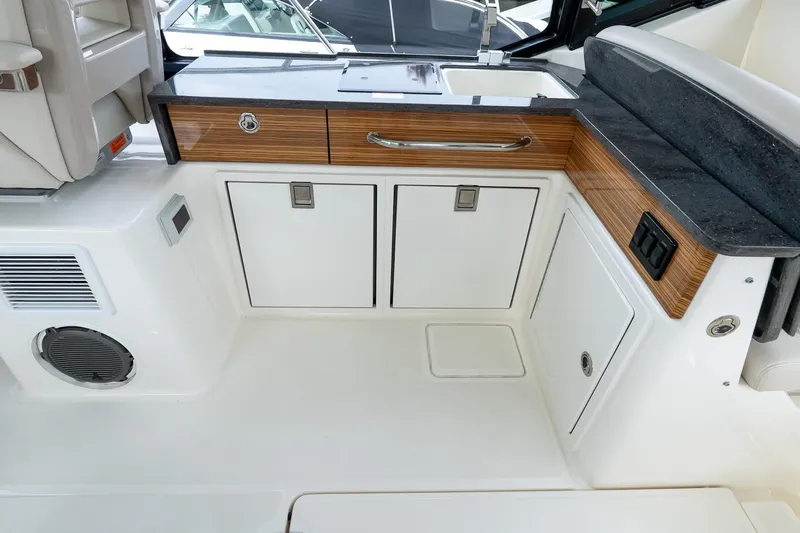  Yacht Photos Pics 2024 Boston Whaler 405 Conquest interior with sleek cabinetry and modern design.