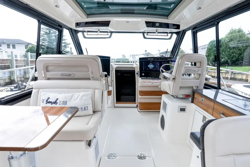  Yacht Photos Pics Luxurious interior of 2024 Boston Whaler 405 Conquest boat with modern helm and seating.