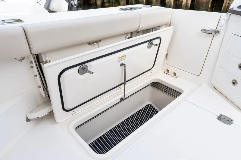  Yacht Photos Pics 2024 Boston Whaler 405 Conquest boat storage compartment with open hatch.