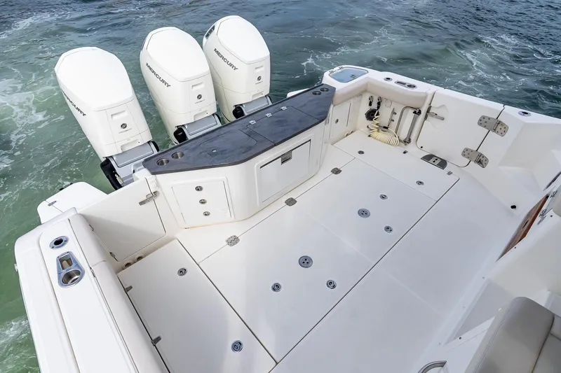  Yacht Photos Pics 2024 Boston Whaler 405 Conquest boat deck with triple Mercury engines.