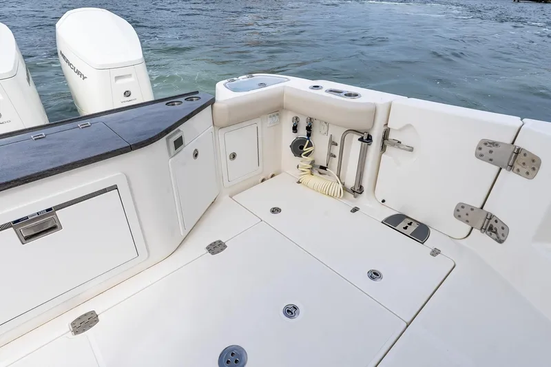  Yacht Photos Pics 2024 Boston Whaler 405 Conquest boat deck with storage and dual Mercury engines.