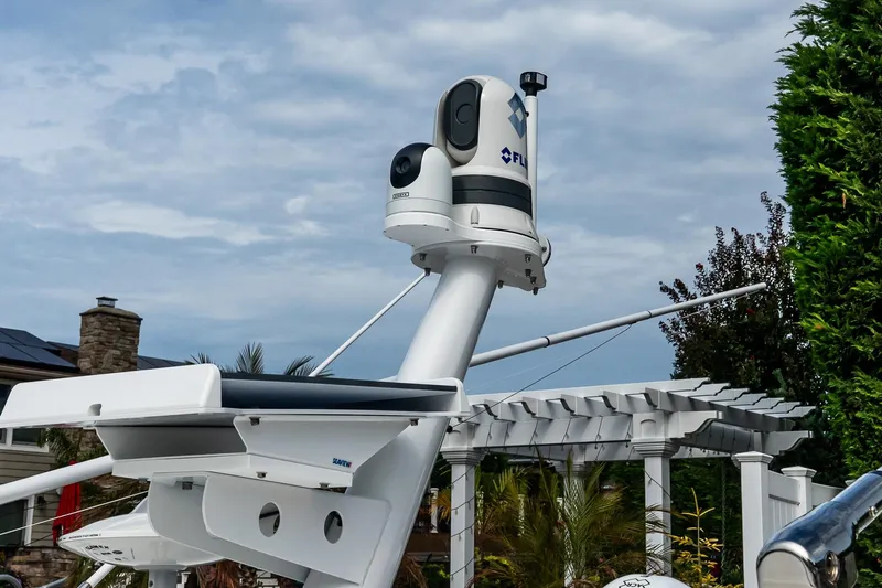  Yacht Photos Pics 2024 Boston Whaler 405 Conquest radar and camera system against a cloudy sky.