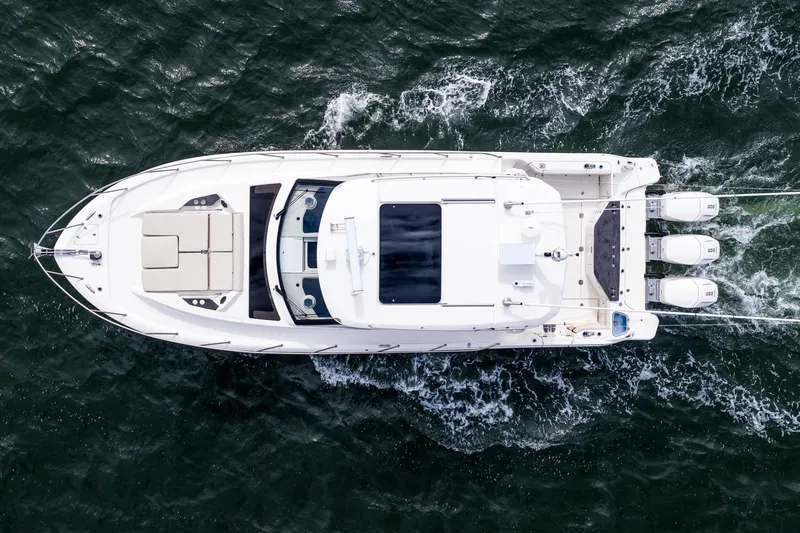  Yacht Photos Pics Top view of 2024 Boston Whaler 405 Conquest yacht cruising on water.