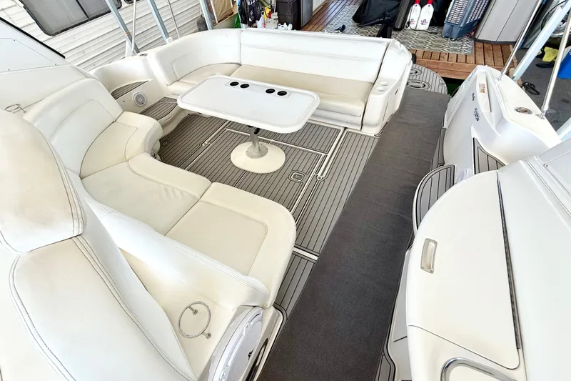 Notorious Yacht Photos Pics Luxurious seating area on a 2003 Sea Ray 460 Sundancer yacht with elegant white upholstery.