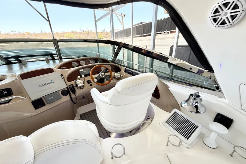 Notorious Yacht Photos Pics Interior view of 2003 Sea Ray 460 Sundancer yacht cockpit with Garmin navigation system.