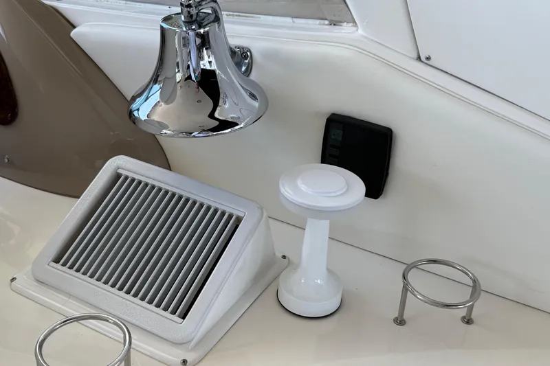 Notorious Yacht Photos Pics 2003 Sea Ray 460 Sundancer boat interior with chrome bell, vent, and cup holder.