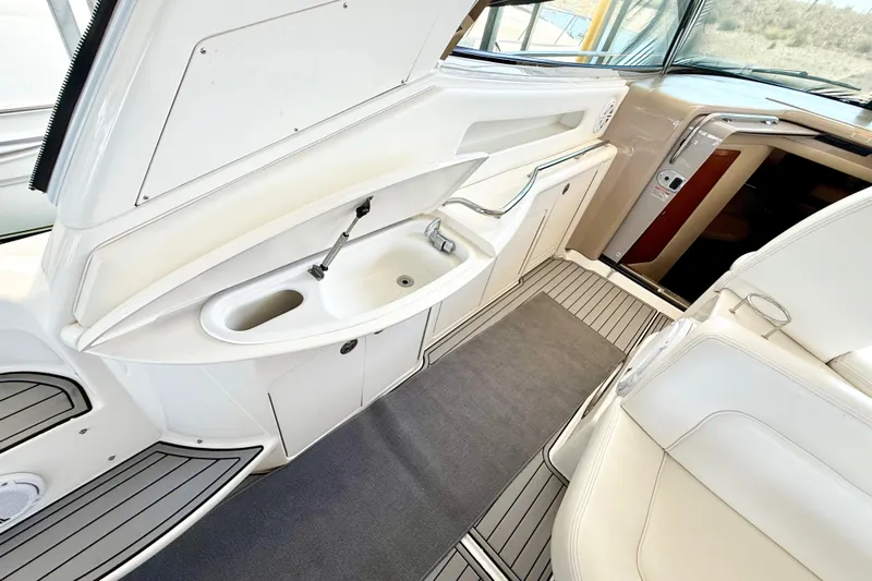 Notorious Yacht Photos Pics Interior of 2003 Sea Ray 460 Sundancer yacht, featuring a sleek sink and seating area.