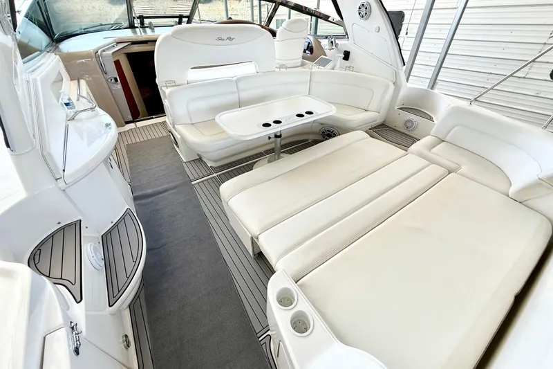 Notorious Yacht Photos Pics Luxurious interior of a 2003 Sea Ray 460 Sundancer yacht with white leather seating.