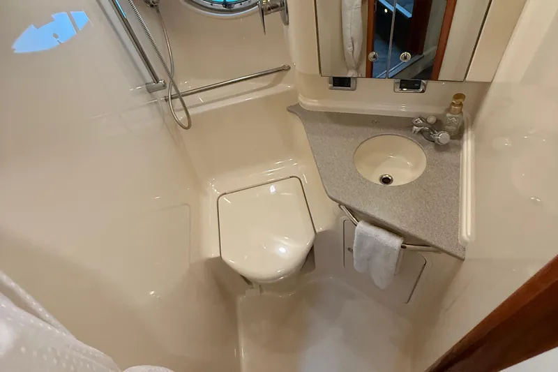 Notorious Yacht Photos Pics Bathroom interior of 2003 Sea Ray 460 Sundancer yacht, featuring sink and shower.