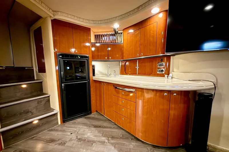 Notorious Yacht Photos Pics Luxurious 2003 Sea Ray 460 Sundancer yacht interior with elegant wood cabinetry and modern amenities.