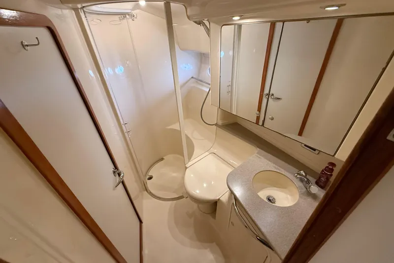 Notorious Yacht Photos Pics Luxurious bathroom in 2003 Sea Ray 460 Sundancer yacht with shower and vanity.