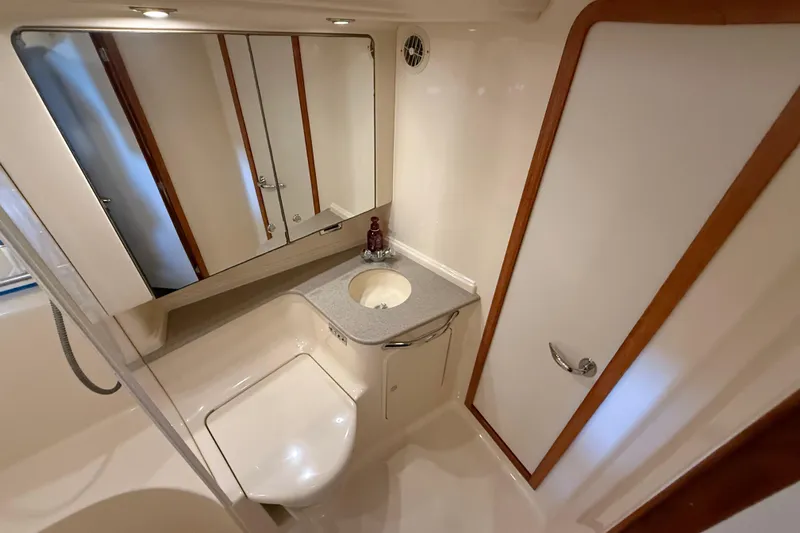 Notorious Yacht Photos Pics Luxurious bathroom in 2003 Sea Ray 460 Sundancer yacht with modern fixtures.